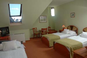 Standard triple with private facilities (bath and shower), and breakfast